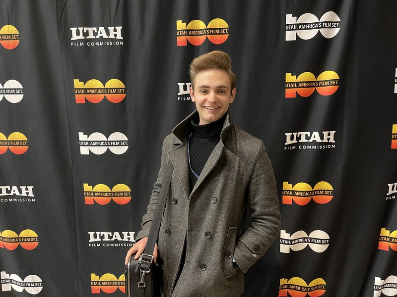 Zander Cooper at the Focus on the Future Film Festival, in front of the Utah Film Commission backdrop