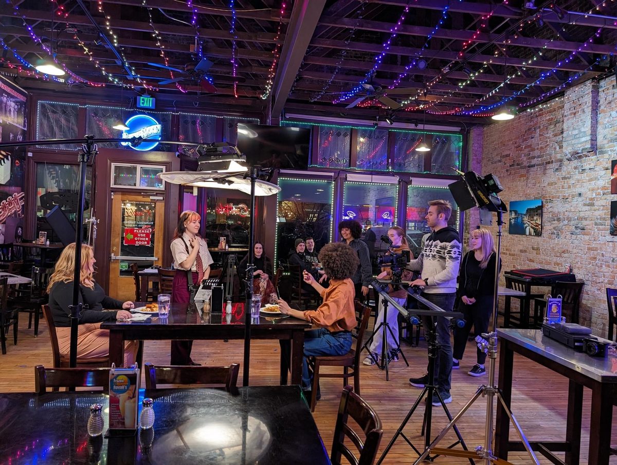 Cast and crew setting up in a bar